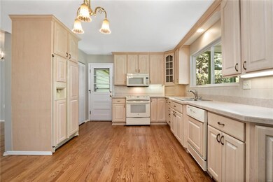 Kitchen with refinished hardwood floors to match the Living Room, Dining Room and Family Room.
