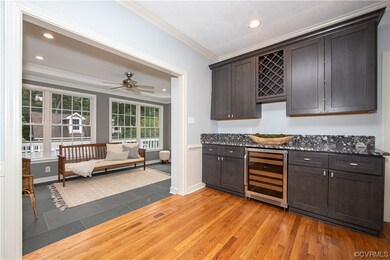 Kitchen with crown molding, dark countertops, ceil