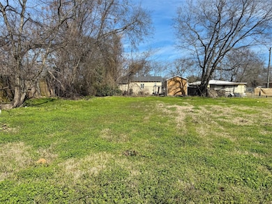 View of yard with an outbuilding, a storage shed, 