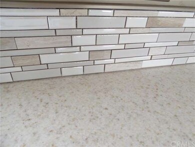 NEW BACKSPLASH AND COUNTER TOP IN KITCHEN.