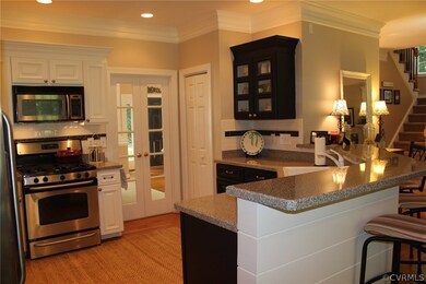 Kitchen view to dining room. Notice the custom shi