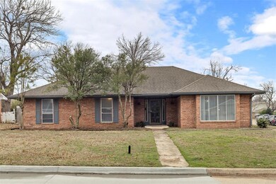 Single story home with a shingled roof, a front ya