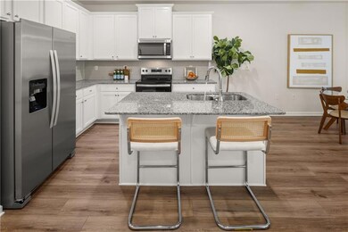 Kitchen with white cabinets, stainless steel appli