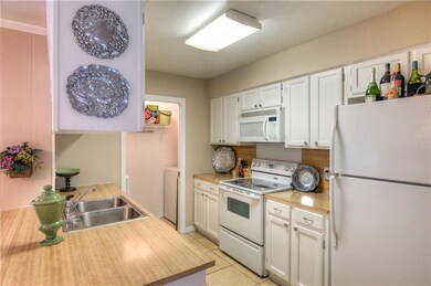 Kitchen with breakfast bar open to eating area.