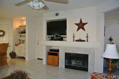 Family room with media niche and cozy fireplace