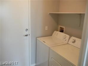 Laundry area with washer and clothes dryer and lau