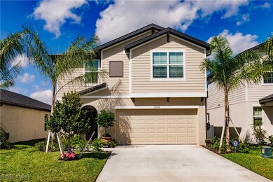 View of front of property featuring a garage and a