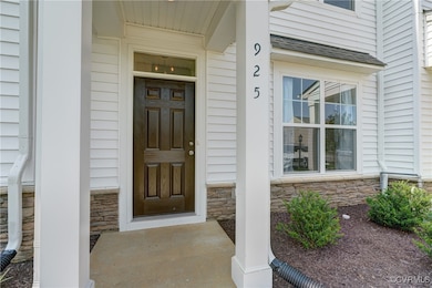 Doorway to property featuring stone siding and a p