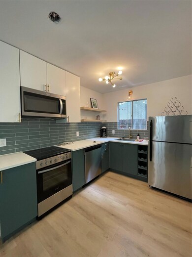 Kitchen with refrigerator, range, dishwashing mac