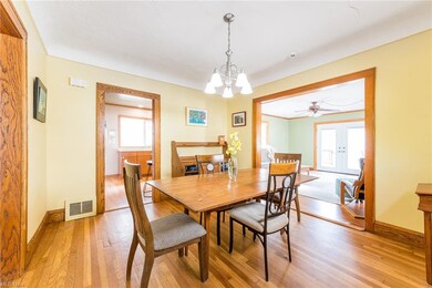 As you enter the formal dining space you see the kitchen and the large family room in the back.