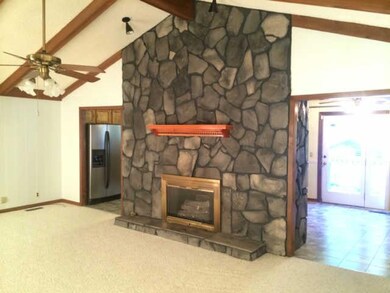Gas fireplace adds warmth to this large living room.