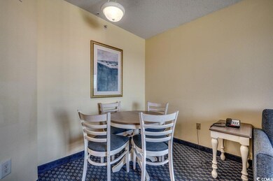 Dining room featuring a textured ceiling