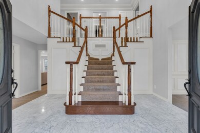 Grand entrance into the elegant foyer.