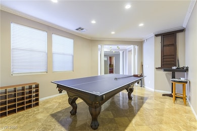 Rec room featuring crown molding, recessed lightin