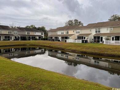 Back of house with a water view and a residential 