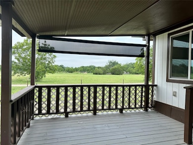 Deck featuring a lawn