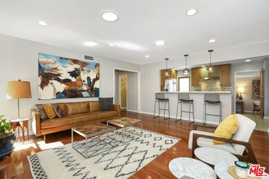 Solar tubes, leather bar stools kitchen island courtesy of Emily Johnson, The Loved House