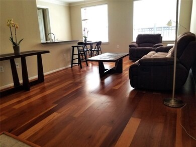 Open family room with hardwood floors. Natural lig