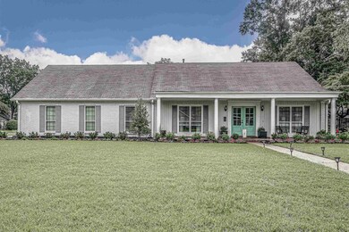 Ranch-style home featuring a front yard