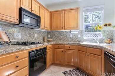 Rich granite countertops and backsplash.  This kit
