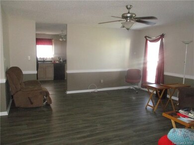 another view of great room and laminate wood floor