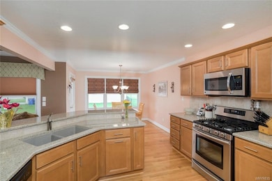 Kitchen with crown molding, soft close maple cabin