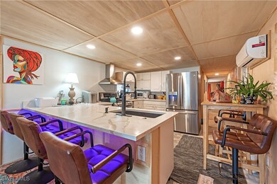 Kitchen featuring stainless steel refrigerator wit