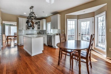 The huge eat in area is bathed in natural light.  