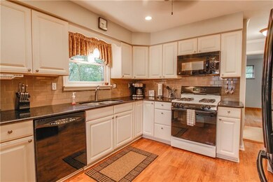 This beautifully updated kitchen features granite 