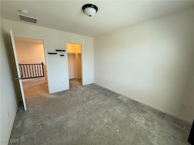 Unfurnished bedroom with carpet flooring, a spacio