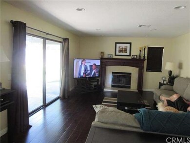 Family Room with fireplace and hardwood flooring