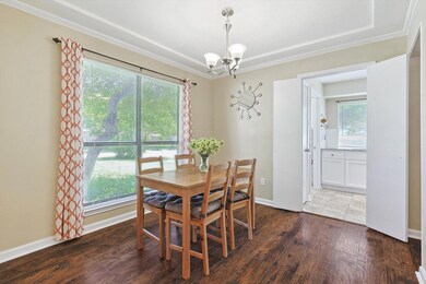 Dining area featuring crown molding, an inviting c