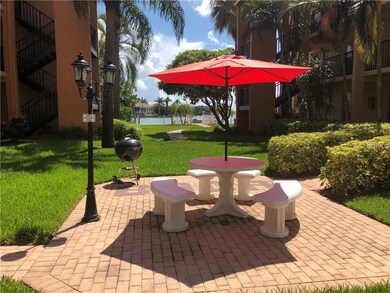 Picnic table and grill in courtyard in front of un