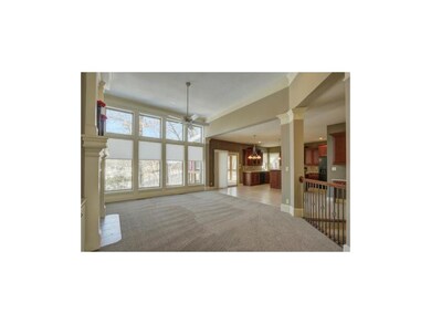 Gorgeous windows look out to heavily treed backyar