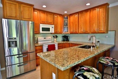 Kitchen over looks Family Room.  Granite Counter T