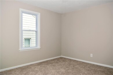 Empty room with light carpet