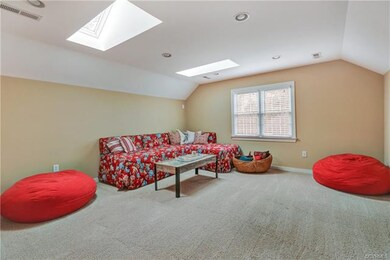 Third floor recreation room with a full bath. Two skylights and game closet. Recessed lights and carpet. Access to large walk in attic.