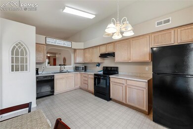 Newer appliances include a smooth top range oven, 