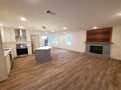 Big open floor plan with wood buring fireplace