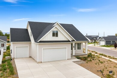 Modern inspired farmhouse featuring roof with shingles, board and batten siding, driveway, and an attached garage