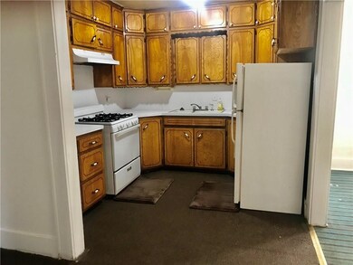 Great cabinet space in this open kitchen.  Stove a