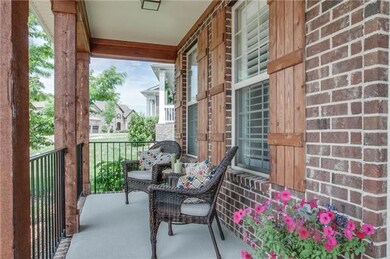 The front porch is 20x6, having a bead board ceiling & wrought iron railing. Notice the cedar columns, trim & shutters.  This is a custom built home, by Regent Builders & the only existing floor plan, in the development. Custom means special.