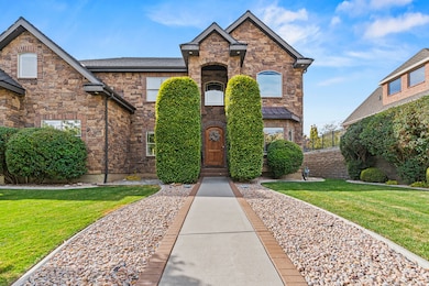 View of front of property featuring stone siding
