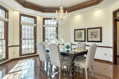 Dining room flanks the entry and is a great spot for entertaining.  Beautiful angled rooms is one of the great architectural details in this home.