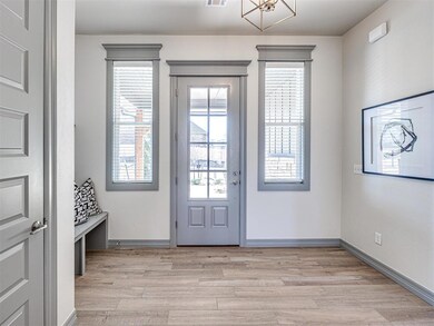 Doorway featuring light wood-type flooring
