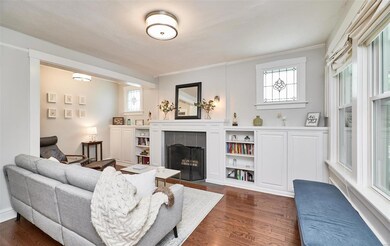 Formal living room with built-ins on either side of fireplace.  The fireplace isn't functional!