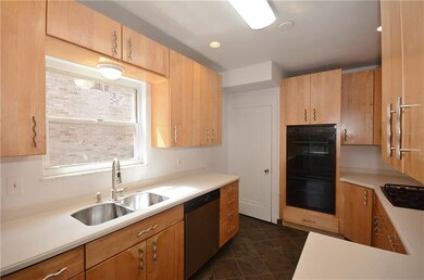 Large long kitchen with lots of storage, double bo