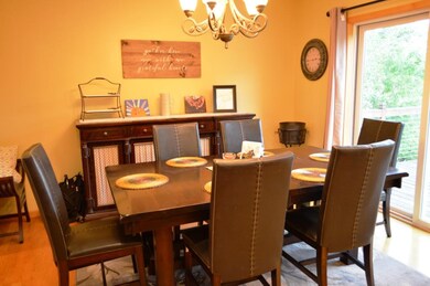 Informal dining room with patio door to deck.