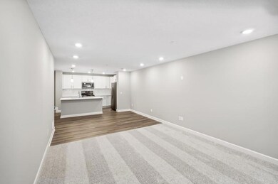 Well-designed layout with the kitchen overlooking the open main floor filled with natural light.