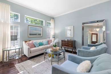 The formal living room is a welcoming space to hos